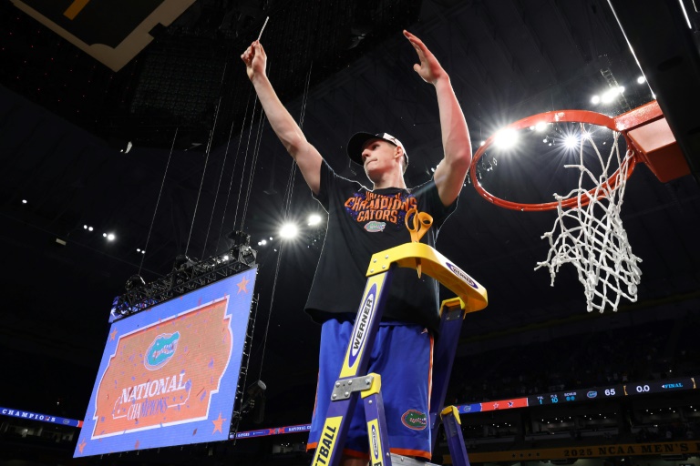 Australian big man Alex Condon celebrates a Florida Gators victory in the NCAA final last month and said he has opted out of the NBA Draft so he can return to Florida next season (JAMIE SQUIRE)