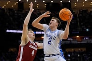 Duke forward Cooper Flagg (2) puts up a shot against Alabama guard Aden Holloway (2) during...