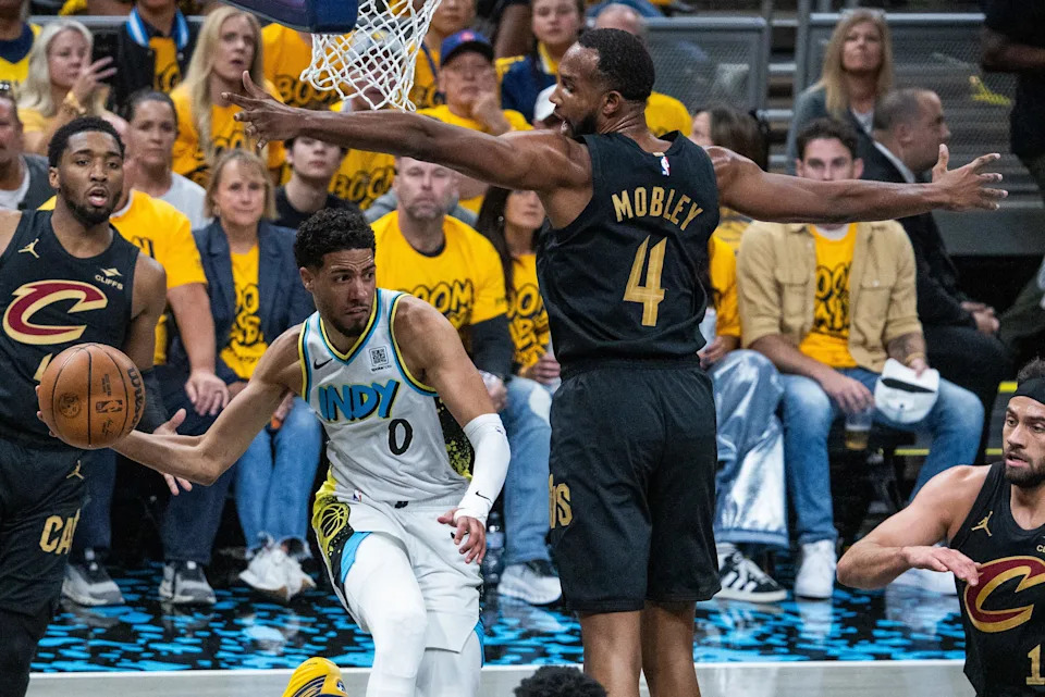 May 9, 2025; Indianapolis, Indiana, USA; Indiana Pacers guard Tyrese Haliburton (0) passes the ball while Cleveland Cavaliers forward Evan Mobley (4) defends during game three of the second round for the 2025 NBA Playoffs at Gainbridge Fieldhouse. Mandatory Credit: Trevor Ruszkowski-Imagn Images