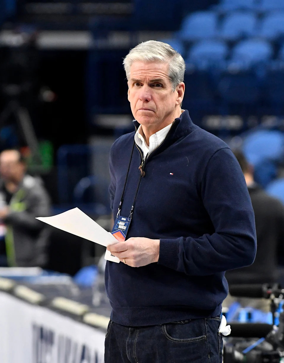CBS television commentator Jim Spanarkel watches the Princeton practice session for the first round of 2017 NCAA Men's Basketball Tournament.
