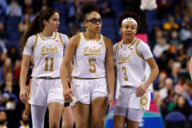 Olivia Miles #5 and Hannah Hidalgo during a timeout.