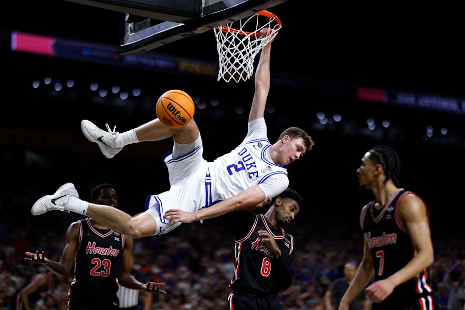 SAN ANTONIO, TEXAS - APRIL 5: Cooper Flagg #2 of the Duke Blue Devils dunks the ball against the Houston Cougars in the first half during the Final Four round of the men's NCAA basketball tournament at Alamodome on April 5, 2025 in San Antonio, Texas. (Photo by Lance King/Getty Images)