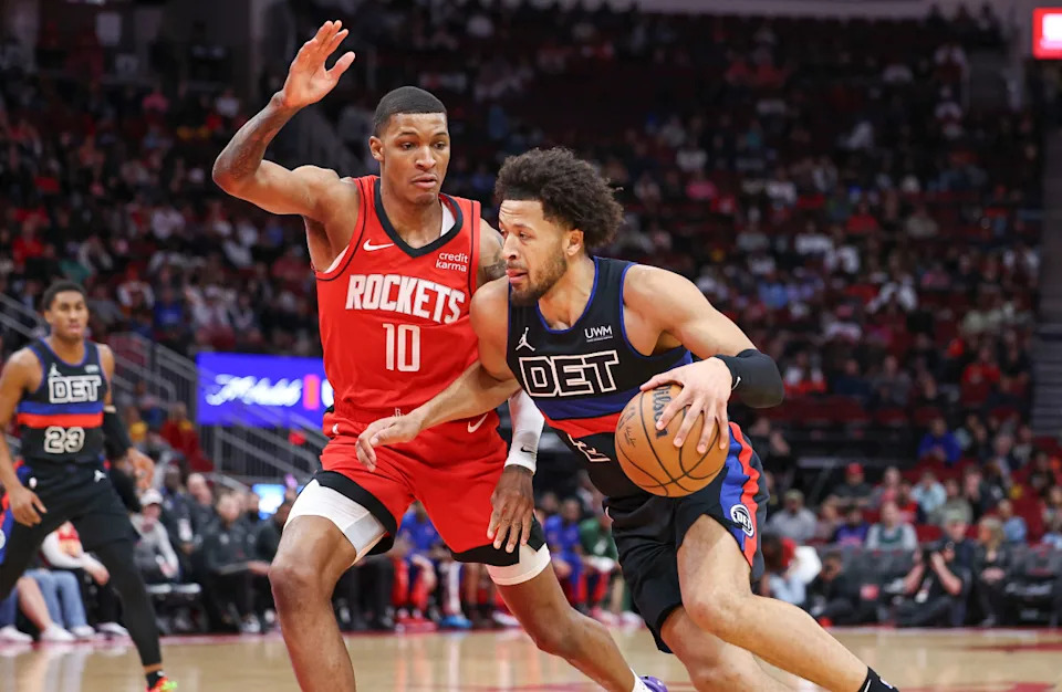 Jan 1, 2024; Houston, Texas, USA; Detroit Pistons guard Cade Cunningham (2) drives with the ball as Houston Rockets forward Jabari Smith Jr. (10) defends during the first quarter at Toyota Center. © Troy Taormina-Imagn Images