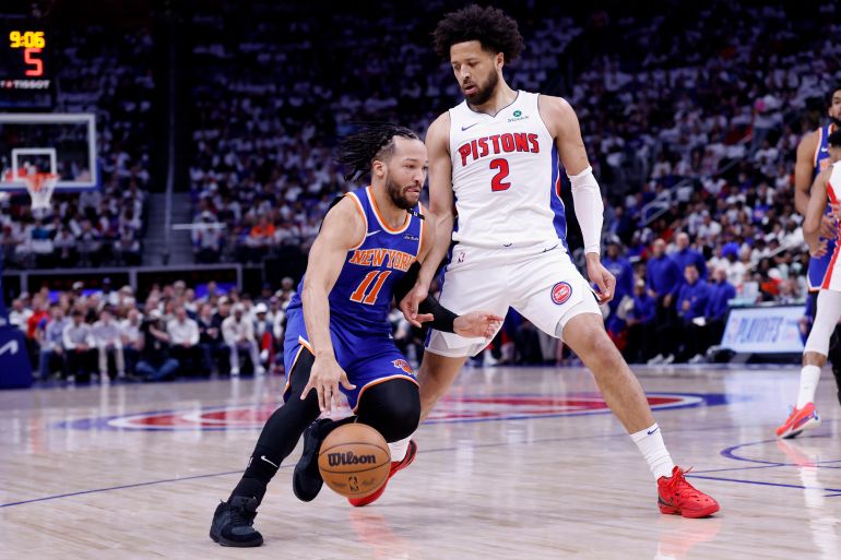 May 1, 2025; Detroit, Michigan, USA; New York Knicks guard Jalen Brunson (11) dribbles defended by Detroit Pistons guard Cade Cunningham (2) in the first half during game six of first round for the 2024 NBA Playoffs at Little Caesars Arena. Mandatory Credit: Rick Osentoski-Imagn Images