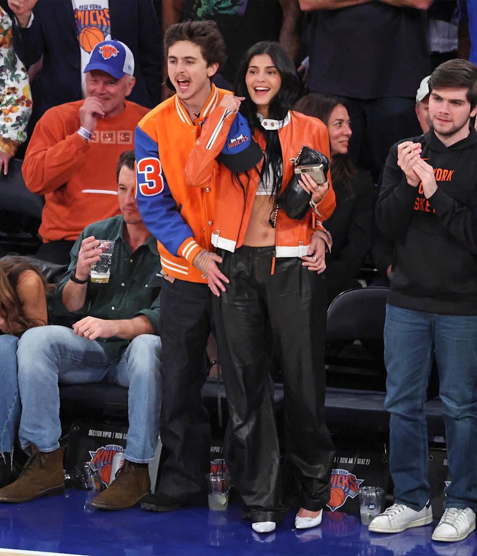 The duo twinned in orange jackets while cheering on the Knicks at Madison Square Garden. Charles Wenzelberg / New York Post