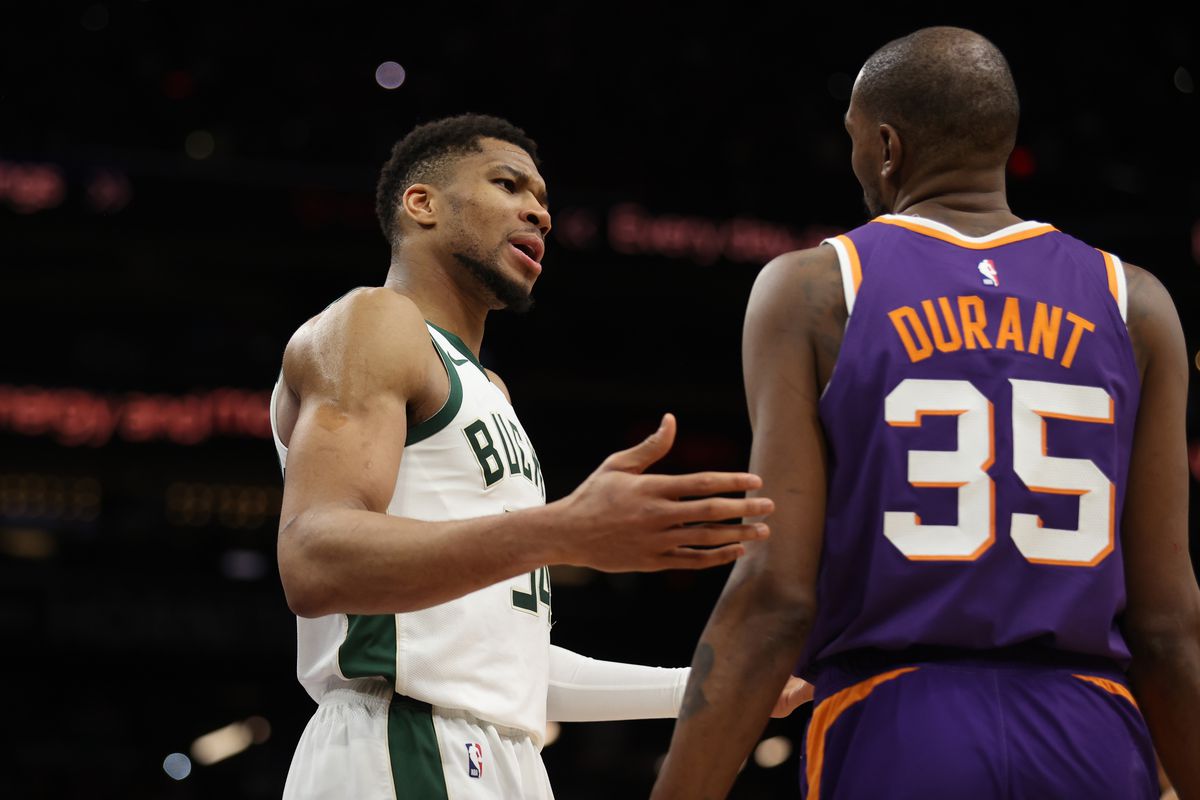 Giannis Antetokounmpo #34 of the Milwaukee Bucks reacts to Kevin Durant #35 of the Phoenix Suns during the second half of the NBA game at PHX Arena on March 24, 2025 in Phoenix, Arizona. Milwaukee Bucks v Phoenix Suns