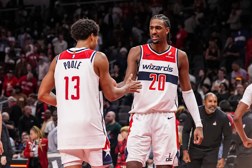 Oct 28, 2024; Atlanta, Georgia, USA; Washington Wizards guard Jordan Poole (13) and forward Alexandre Sarr (20) react after the Wizards defeated the Atlanta Hawks at State Farm Arena. Mandatory Credit: Dale Zanine-Imagn Images