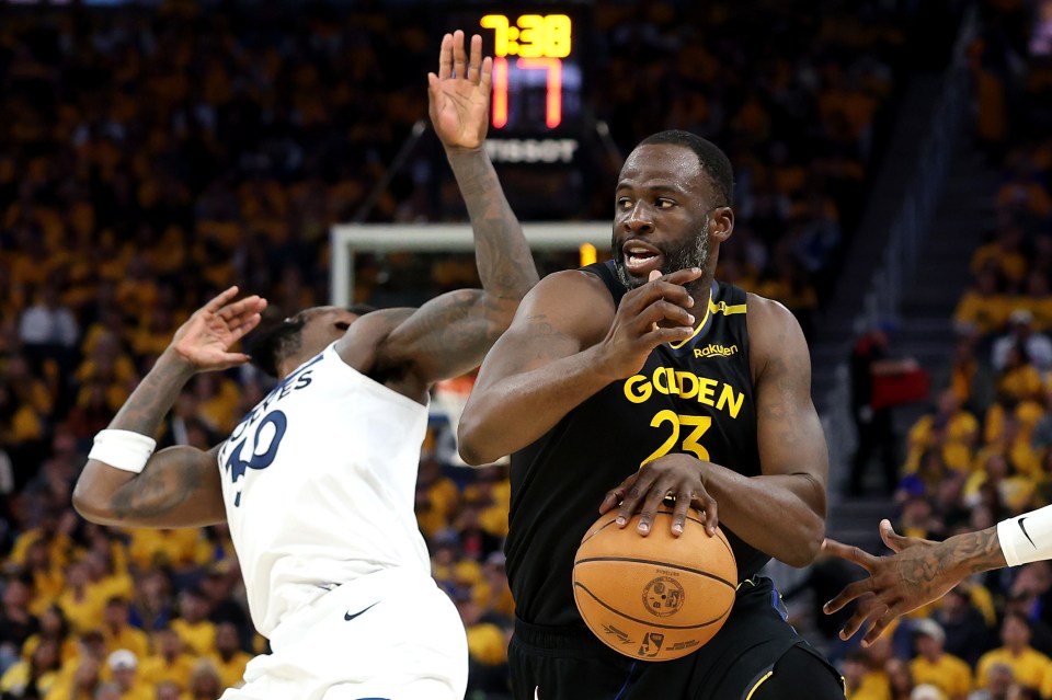 Draymond Green #23 of the Golden State Warriors dribbling the ball.