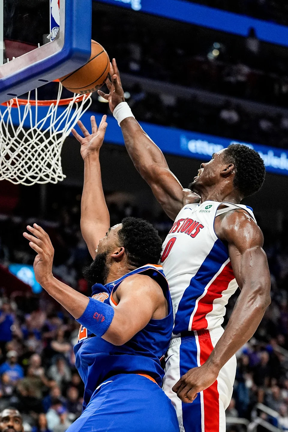 Detroit Pistons center Jalen Duren (0) blocks a layup from New York Knicks center Karl-Anthony Towns (32) during the second half of Game 4 of Eastern Conference playoff first round at Little Caesars Arena in Detroit on Sunday, April 27, 2025.