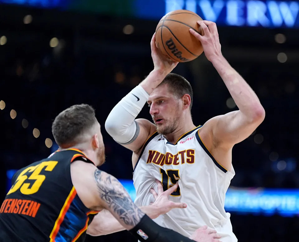 Denver's Nikola Jokic (15) looks to get by Oklahoma City's Isaiah Hartenstein (55) during the second half of Game 1 of the NBA playoff series between the Oklahoma City Thunder and the Denver Nuggets at Paycom Center in Oklahoma City, Monday, May, 5, 2025.