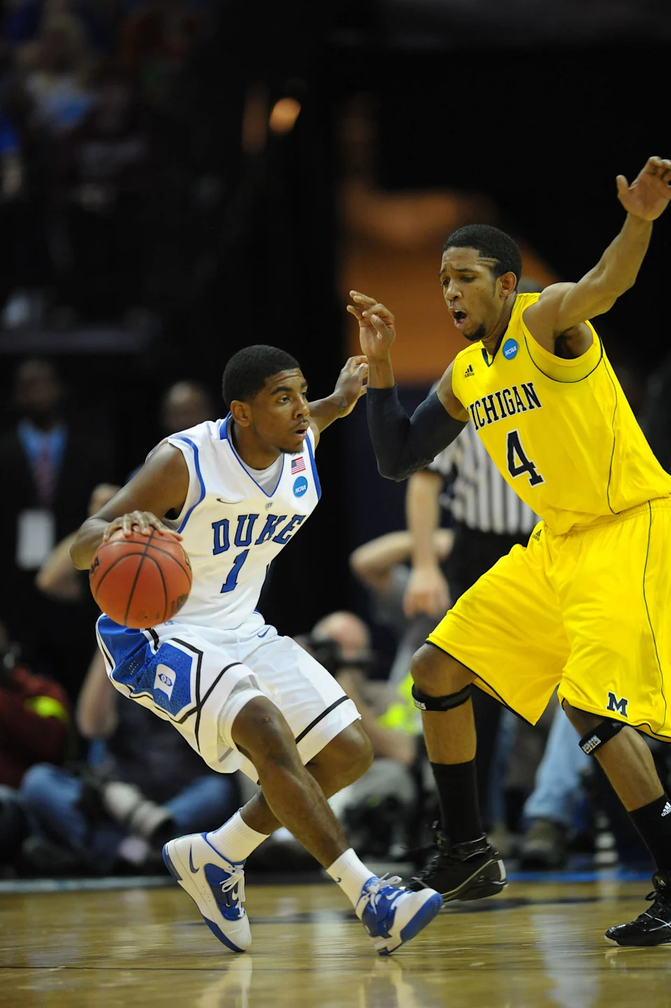 Duke Blue Devils guard Kyrie Irving dribbles as Michigan Wolverines guard Darius Morris defends.