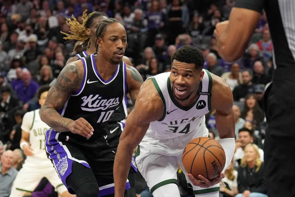 Mar 22, 2025; Sacramento, California, USA; Milwaukee Bucks forward Giannis Antetokounmpo (34) dribbles against Sacramento Kings forward DeMar DeRozan (10) during the first quarter at Golden 1 Center.© Darren Yamashita-Imagn Images