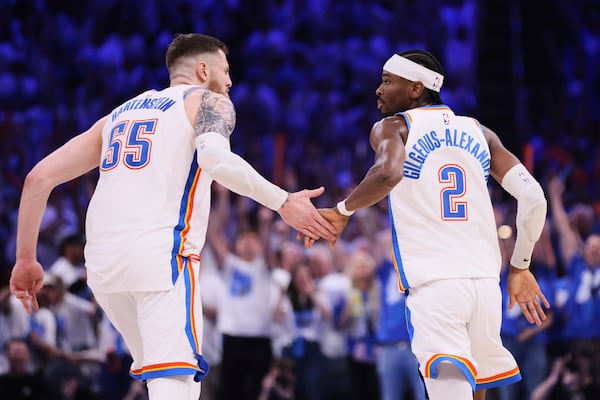 Oklahoma City Thunder's Isaiah Hartenstein (55) and Shai Gilgeous-Alexander (2) celebrate in the second half of Game 5 of an NBA basketball second-round playoff series against the Denver Nuggets Tuesday, May 13, 2025, in Oklahoma City. (AP Photo/Nate Billings)