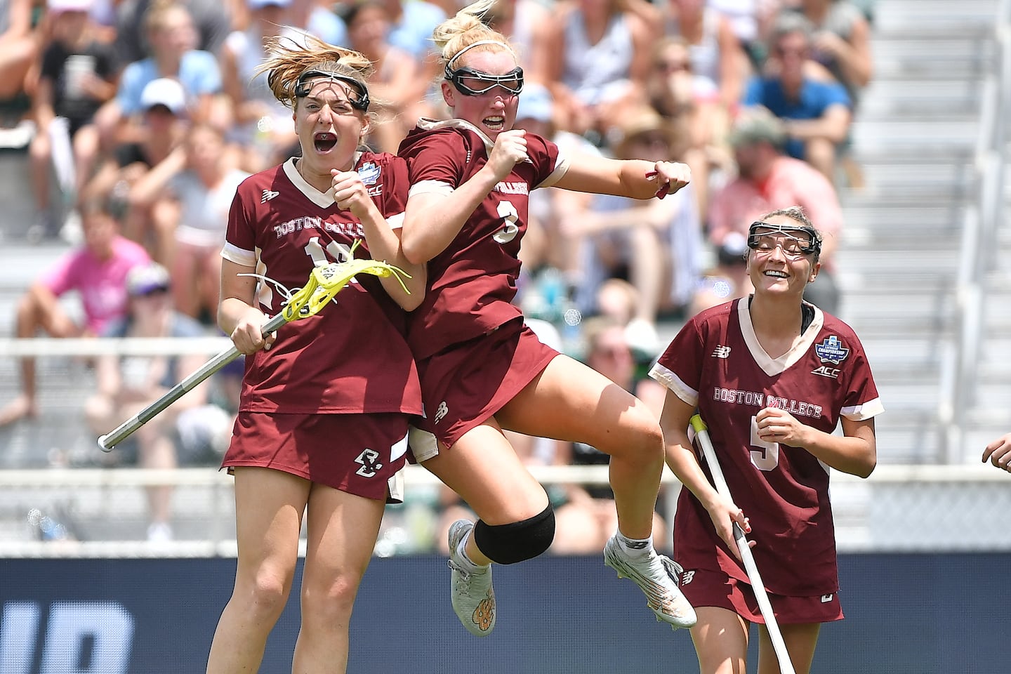 Andrea Reynolds (left) and McKenna Davis celebrate with Belle Smith (right) during the NCAA championship game in 2024.