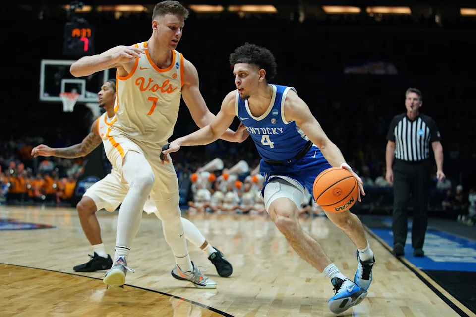 Mar 28, 2025; Indianapolis, IN, USA; Kentucky Wildcats guard Koby Brea (4) dribbles the ball on Tennessee Volunteers forward Igor Milicic Jr. (7) in the second half during a Midwest Regional semifinal of the 2025 NCAA tournament at Lucas Oil Stadium. Mandatory Credit: Robert Goddin-Imagn Images