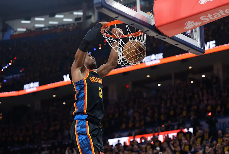 Thunder guard Shai Gilgeous-Alexander (2) dunks against the Nuggets.Alonzo Adams-Imagn Images