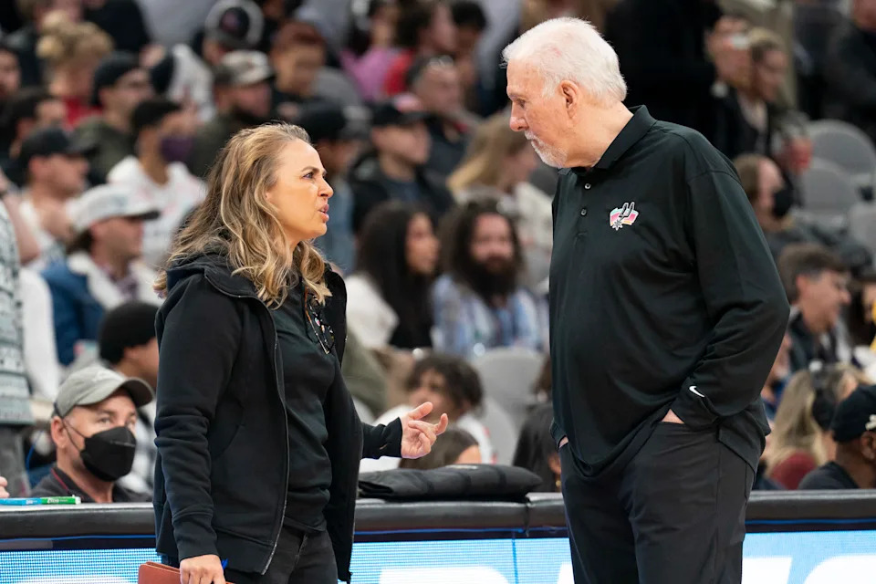 Mar 11, 2022; San Antonio, Texas, USA; San Antonio Spurs head coach Gregg Popovich talks with assistant coach Becky Hammon during the first half against the Utah Jazz at AT&T Center. Mandatory Credit: Scott Wachter-USA TODAY Sports