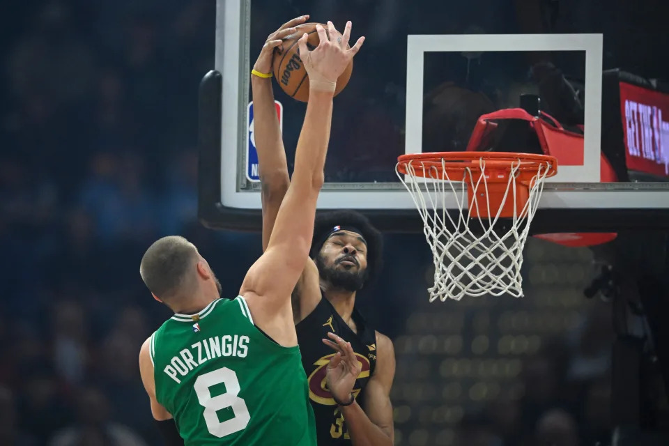 Feb 4, 2025; Cleveland, Ohio, USA; Cleveland Cavaliers center Jarrett Allen (31) blocks a shot by Boston Celtics center Kristaps Porzingis (8) in the first quarter at Rocket Mortgage FieldHouse. Mandatory Credit: David Richard-Imagn Images