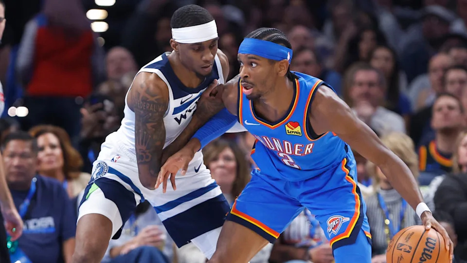Minnesota Timberwolves forward Jaden McDaniels defends a drive by Oklahoma City Thunder guard Shai Gilgeous-Alexander.Alonzo Adams-Imagn Images