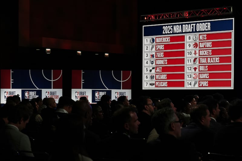 People attend the NBA basketball draft lottery in Chicago, Monday, May 12, 2025.