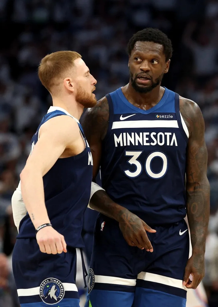 Donte DiVincenzo of the Minnesota Timberwolves celebrates with <br>Julius Randle against the Oklahoma City Thunder during the first <br>quarter in Game Three of the Western Conference Finals. Getty Images