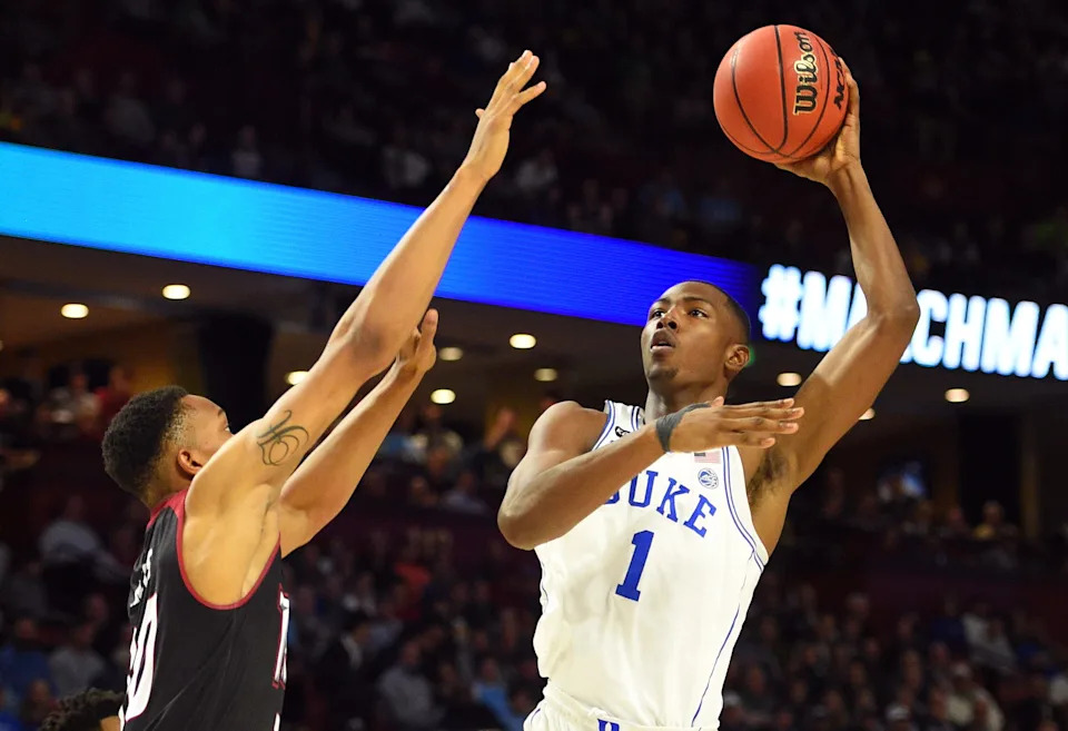 Duke Blue Devils forward Harry Giles shoots against Troy Trojans forward Alex Hicks.