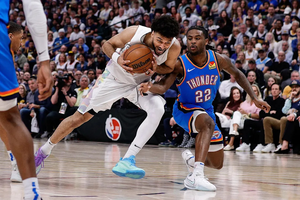 May 15, 2025; Denver, Colorado, USA; Denver Nuggets guard Jamal Murray (27) drives to the net against Oklahoma City Thunder guard Cason Wallace (22) in the fourth quarter during game six of the second round for the 2025 NBA Playoffs at Ball Arena. Mandatory Credit: Isaiah J. Downing-Imagn Images