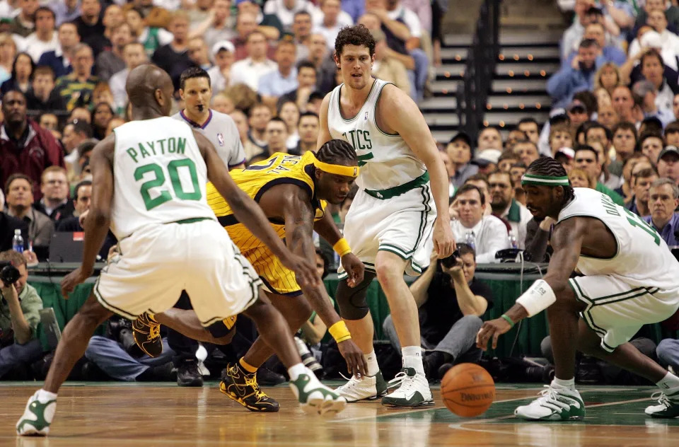 BOSTON - MAY 3: Jermaine O'Neal #7 of the Indiana Pacers goes after a loose ball against Gary Payton #20, Raef LaFrentz #45, and Ricky Davis #12 of the Boston Celtics in Game five of the Eastern Conference Quarterfinals during the 2005 NBA Playoffs at Fleet Center on May 3, 2005 in Boston, Massachusetts.The Pacers defeated the Celtics 90-85 to take a 3-2 lead in their series. NOTE TO USER: User expressly acknowledges and agrees that, by downloading and or using this photograph, User is consenting to the terms and conditions of the Getty Images License Agreement. (Photo by Jim McIsaac/Getty Images)