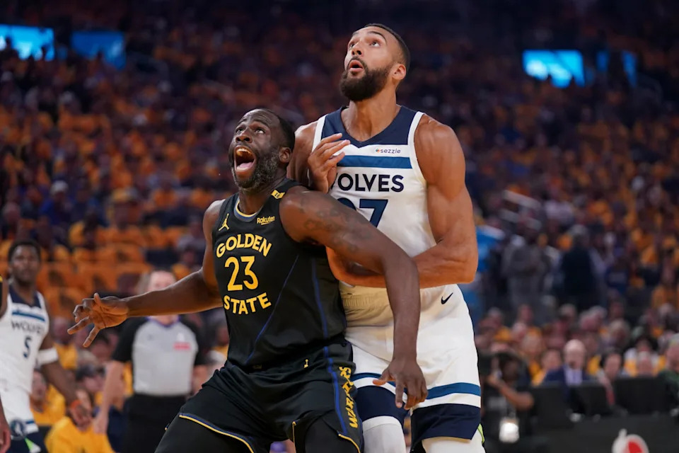 Golden State Warriors forward Draymond Green battles for position with Minnesota Timberwolves center Rudy Gobert.Cary Edmondson-Imagn Images