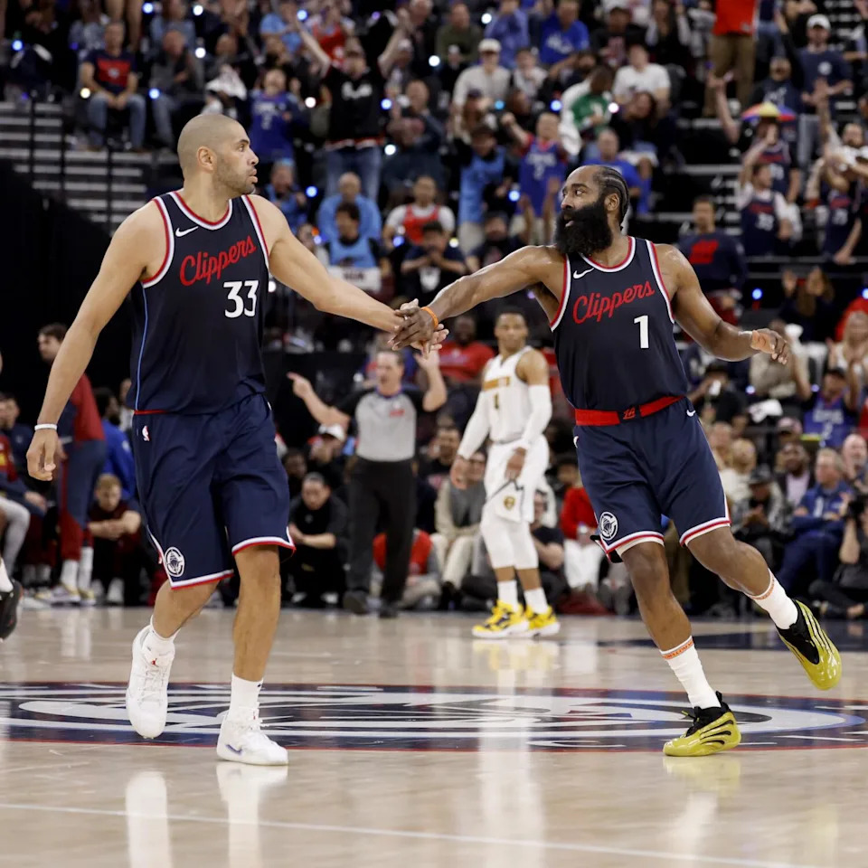 Clippers guard James Harden, right, celebrates with forward Nicolas Batum.