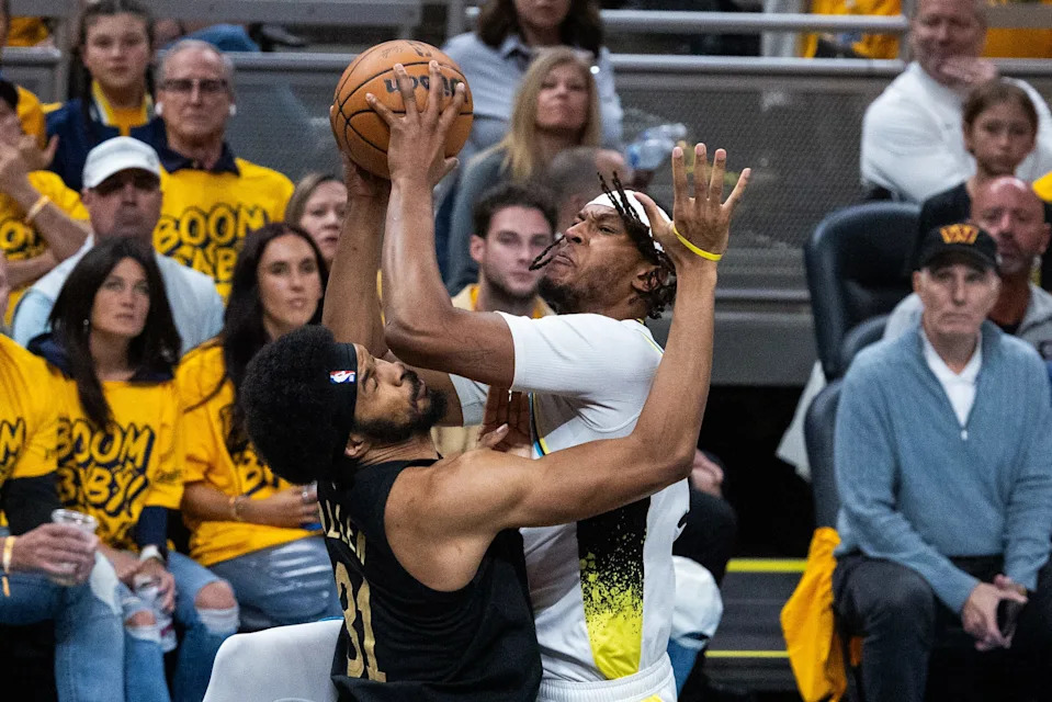 May 9, 2025; Indianapolis, Indiana, USA; Indiana Pacers center Myles Turner (33) shoots the ball while Cleveland Cavaliers center Jarrett Allen (31) defends during game three of the second round for the 2025 NBA Playoffs at Gainbridge Fieldhouse. Mandatory Credit: Trevor Ruszkowski-Imagn Images