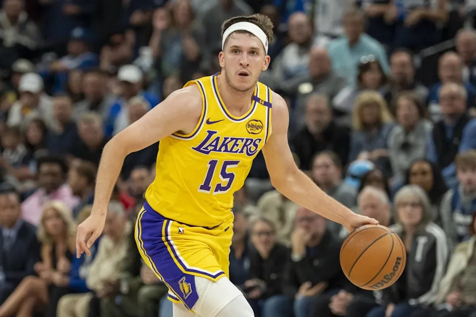 Los Angeles Lakers guard Austin Reaves (15) dribbles the ball against the Minnesota Timberwolves during game three of first round for the 2024 NBA Playoffs at Target Center.Mandatory Credit: Jesse Johnson-Imagn Images
