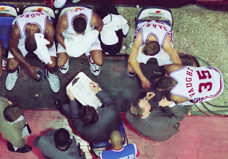 Bill Fitch, Head Coach for the Los Angeles Clippers writes instructions to the team during their NBA Pacific Division basketball game against the Sacramento Kings on 13th March 1997 at the Los Angeles Memorial Sports Arena in Los Angeles.