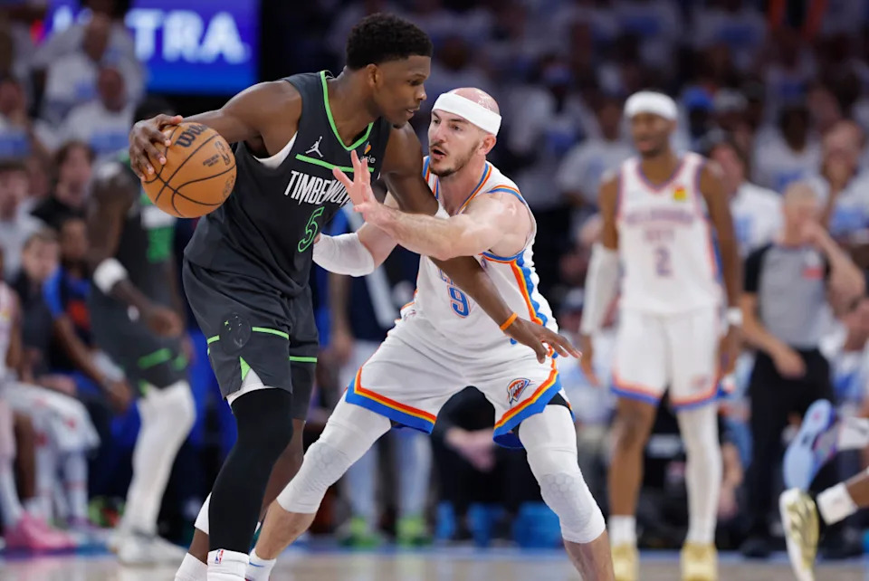 Minnesota Timberwolves guard Anthony Edwards (5) dribbles against Oklahoma City Thunder guard Alex Caruso (9).Credit&colon; Alonzo Adams-Imagn Images