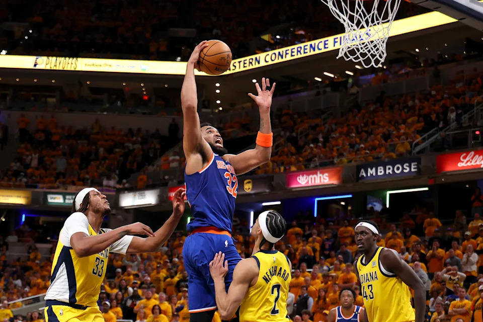 INDIANAPOLIS, INDIANA - MAY 25: Karl-Anthony Towns #32 of the New York Knicks drives to the basket against Andrew Nembhard #2 of the Indiana Pacers during the fourth quarter in Game Three of the Eastern Conference Finals of the 2025 NBA Playoffs at Gainbridge Fieldhouse on May 25, 2025 in Indianapolis, Indiana. NOTE TO USER: User expressly acknowledges and agrees that, by downloading and or using this photograph, User is consenting to the terms and conditions of the Getty Images License Agreement. (Photo by Gregory Shamus/Getty Images)
