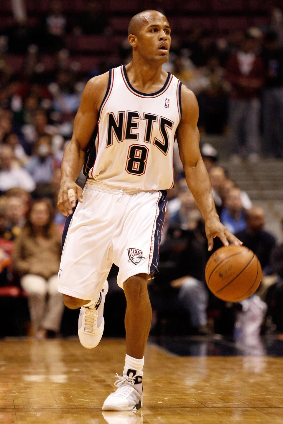 EAST RUTHERFORD, NJ - OCTOBER 20: Eddie Gill #8 of the New Jersey Nets dribbles during the second half of a pre-season game against the New York Knicks on October 20, 2008 at the IZOD Center in East Rutherford, New Jersey. The Knicks won 114-106. NOTE TO USER: User expressly acknowledges and agrees that, by downloading and/or using this Photograph, user is consenting to the terms and conditions of the Getty Images License Agreement. (Photo by Jarrett Baker/Getty Images)