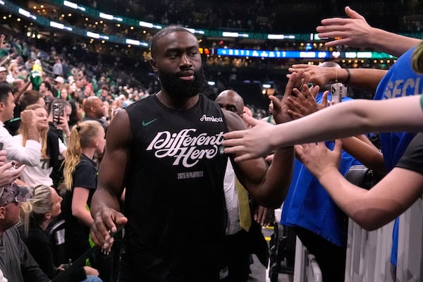 Boston Celtics guard Jaylen Brown is congratulated by fans after eliminating the Orlando Magic following the second half in game 5 of a first-round NBA playoff basketball series, Tuesday, April 29, 2025, in Boston. (AP Photo/Charles Krupa)