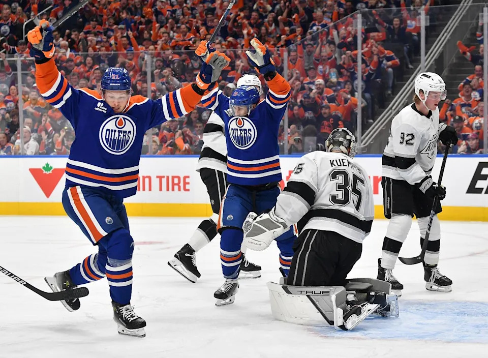 Edmonton Oilers Adam Henrique and Trent Frederic celebrate after scoring in the first period against the Kings