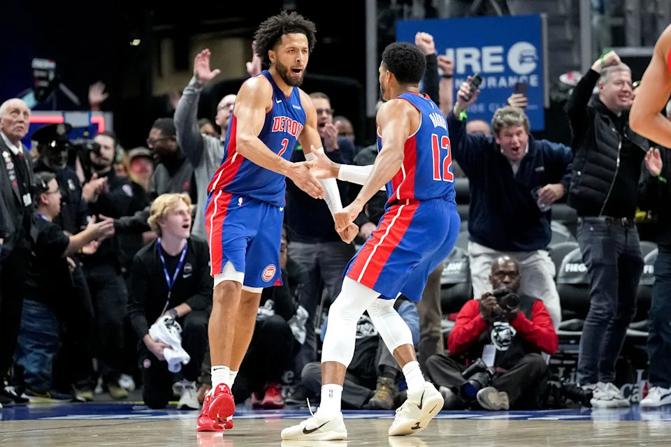 Pistons guard Cade Cunningham celebrates his blocked shot with forward Tobias Harris at the buzzer, leading to a 122-121 win against the Atlanta Hawks at Little Caesars Arena on Nov. 8, 2024 in Detroit.