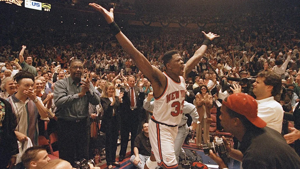 <div>New York Knicks Patrick Ewing (33) raises his arms in victory after going into the crowd to hug his former Georgetown coach John Thompson, left, in the closing seconds of the Knicks win over the Indiana Pacers, Sunday June 5, 1994, (AP Photo/Charles Rex Arbogast)</div>