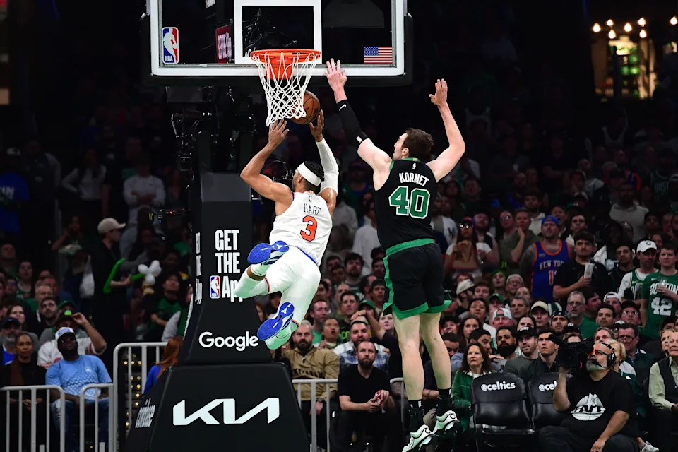 May 14, 2025; Boston, Massachusetts, USA; Boston Celtics center Luke Kornet (40) fouls New York Knicks guard Josh Hart (3) in the second half during game five of the second round for the 2025 NBA Playoffs at TD Garden. Mandatory Credit: Bob DeChiara-Imagn Images