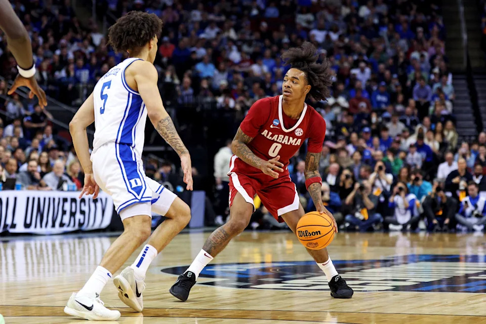 Mar 29, 2025; Newark, NJ, USA; Alabama Crimson Tide guard Labaron Philon (0) handles the ball against Duke Blue Devils guard Tyrese Proctor (5) during the second half in the East Regional final of the 2025 NCAA tournament at Prudential Center. Mandatory Credit: Vincent Carchietta-Imagn Images