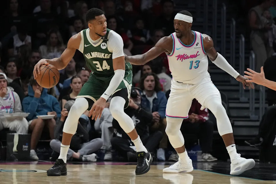 Apr 5, 2025; Miami, Florida, USA; Milwaukee Bucks forward Giannis Antetokounmpo (34) looks to shoot as Miami Heat center Bam Adebayo (13) defends during the first half at Kaseya Center. Mandatory Credit: Jim Rassol-Imagn Images