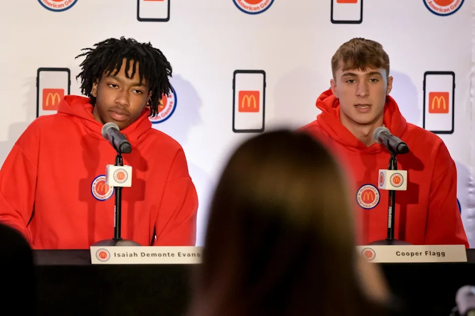 McDonald's All American East forward Isaiah Evans (center) and McDonald's All American East forward Cooper Flagg.Maria Lysaker-Imagn Images
