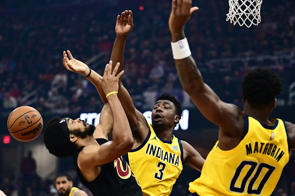 Cleveland Cavaliers center Jarrett Allen, left, battles Indiana Pacers forward Thomas Bryant (3) for a rebound during Game 5 of a second-round playoff series May 13, 2025, in Cleveland, Ohio.