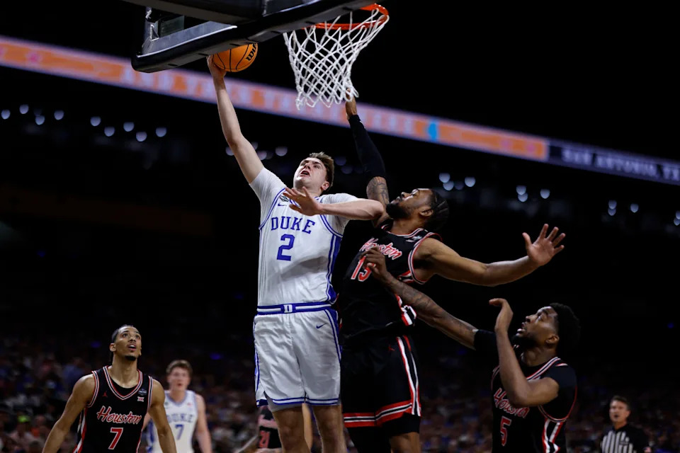 SAN ANTONIO, TEXAS - APRIL 5: Cooper Flagg #2 of the Duke Blue Devils goes to the basket against J'Wan Roberts #13 of the Houston Cougars in the first half during the Final Four round of the men's NCAA basketball tournament at Alamodome on April 5, 2025 in San Antonio, Texas. (Photo by Lance King/Getty Images)