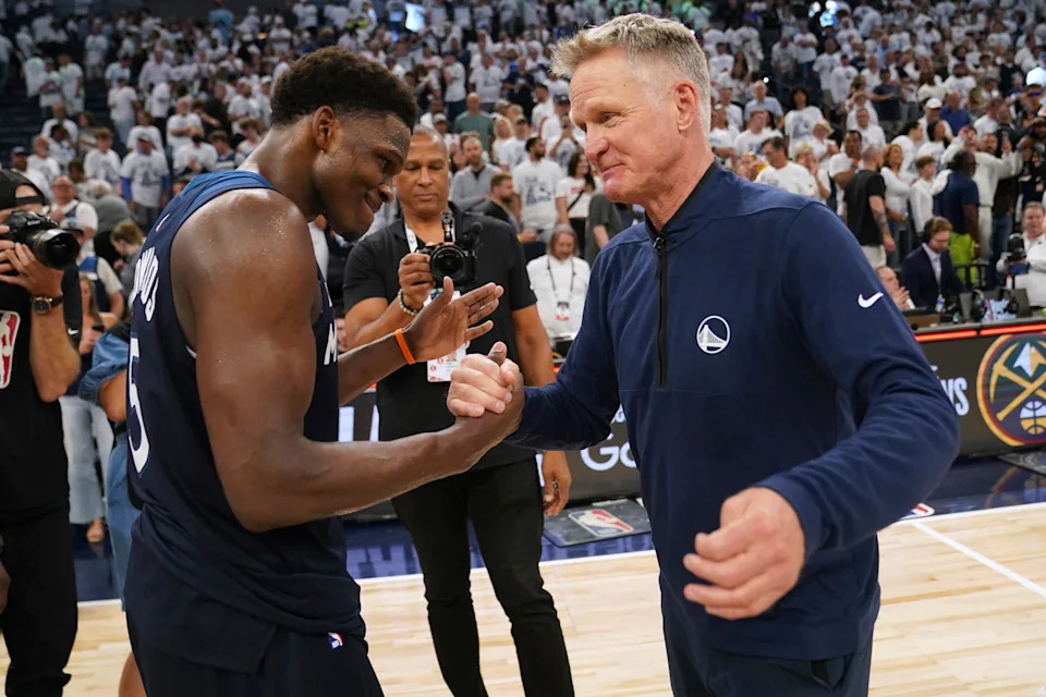 Golden State Warriors head coach Steve Kerr talks with Minnesota Timberwolves guard Anthony Edwards (5) after Game 5 of an NBA basketball second-round playoff series, Thursday, May 15, 2025, in Minneapolis. (AP Photo/Abbie Parr)