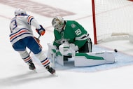 Edmonton Oilers center Mattias Janmark (13) scores a goal against Dallas Stars goaltender...