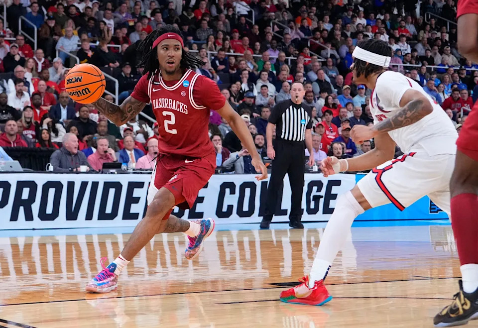 Mar 22, 2025; Providence, RI, USA; Arkansas Razorbacks guard Boogie Fland (2) dribbles against St. John's Red Storm guard Aaron Scott (0) during the second half of a second round men’s NCAA Tournament game at Amica Mutual Pavilion. Mandatory Credit: Gregory Fisher-Imagn Images