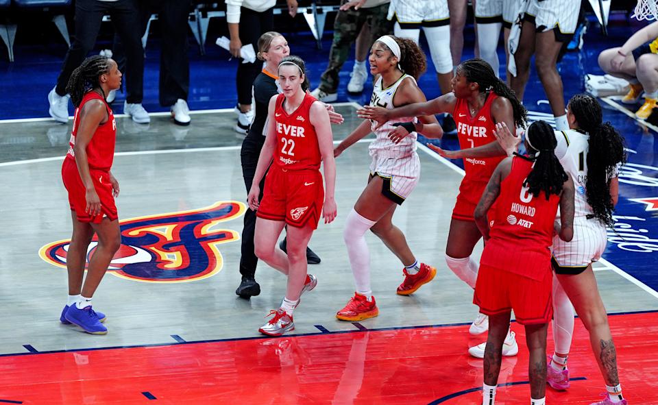 INDIANAPOLIS, IN - MAY 17: Chicago Sky forward Angel Reese (5) reacts after being fouled by Indiana Fever guard Caitlin Clark (22) as Indiana Fever forward Aliyah Boston (7) tries to separate Reese (5) from Clark (22) on May 17, 2025, at Gainbridge Fieldhouse in Indianapolis, Indiana. (Photo by Brian Spurlock/Icon Sportswire via Getty Images)
